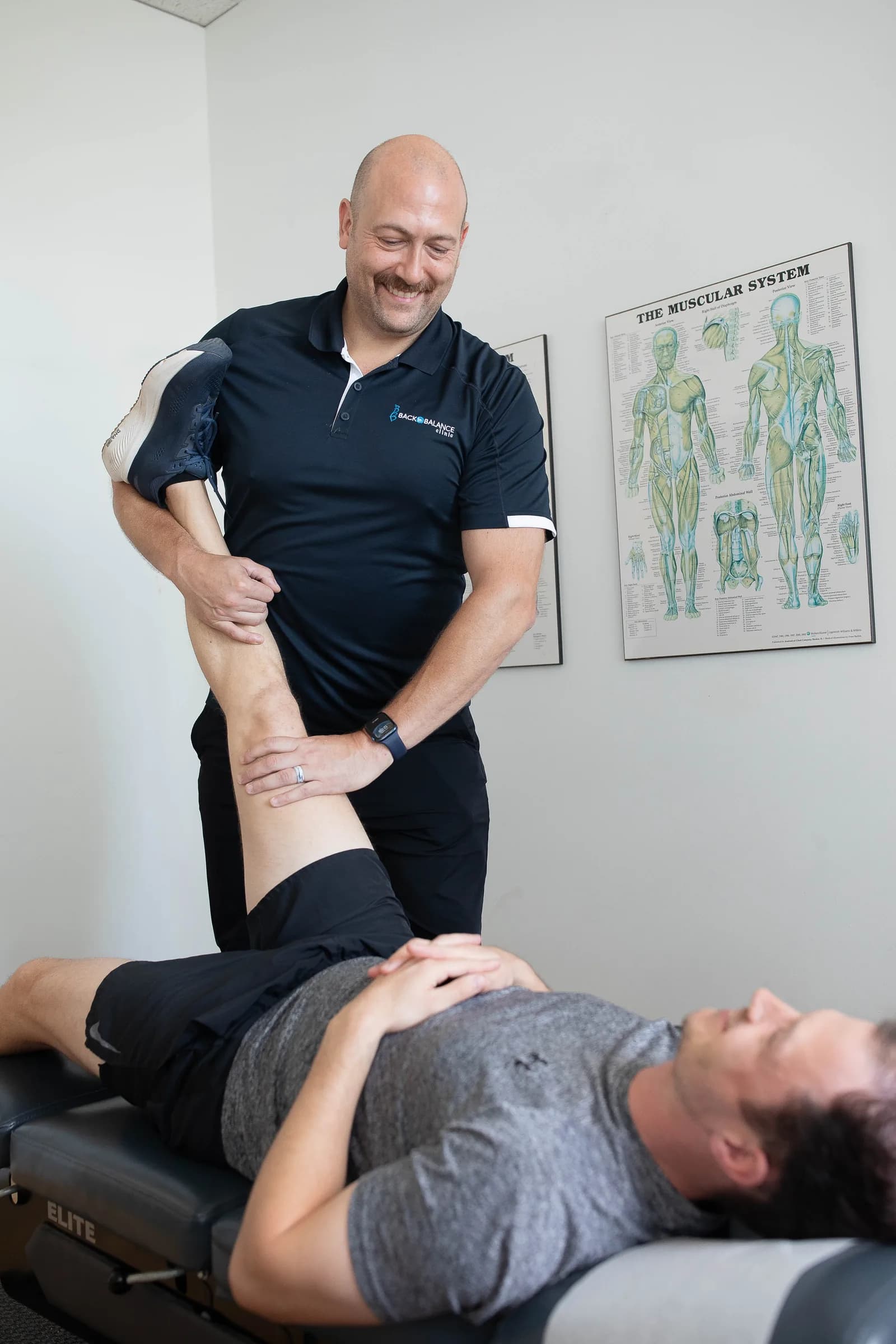 Clinician assessing for lumbar sciatica
