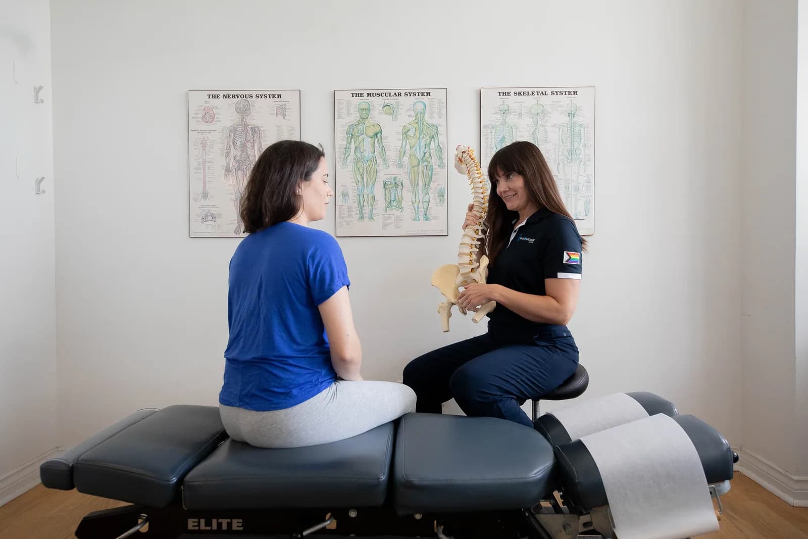 Dr. Lisa Clarke discussing pregnancy-related low back pain with a patient.